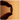 A close up silhouette of a finger and thumb holding a Boquet pill against an orange background.